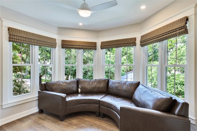 living room featuring ceiling fan, hardwood / wood-style flooring, and a healthy amount of sunlight