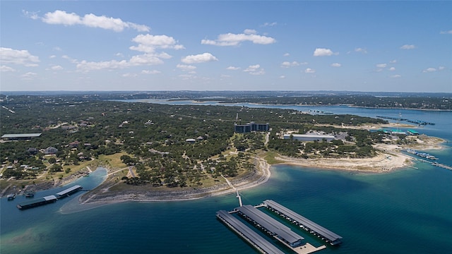 drone / aerial view featuring a water view and a view of the beach