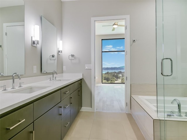 bathroom featuring tile patterned flooring, vanity, ceiling fan, and independent shower and bath