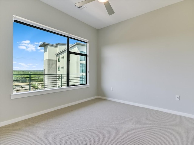 unfurnished room featuring carpet flooring and ceiling fan