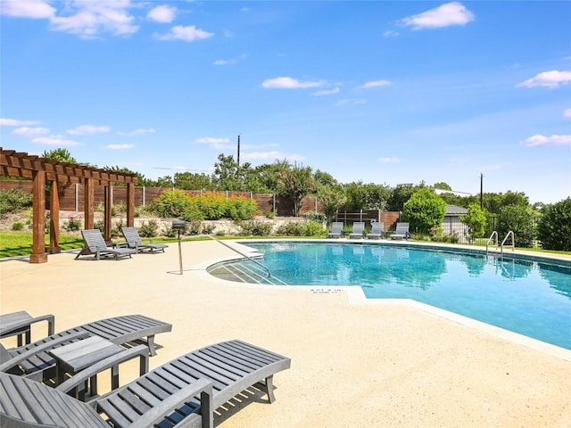 view of swimming pool featuring a pergola and a patio