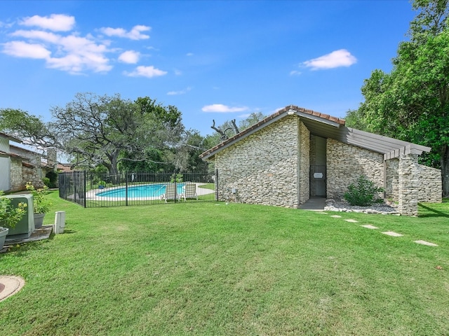 view of yard with a fenced in pool