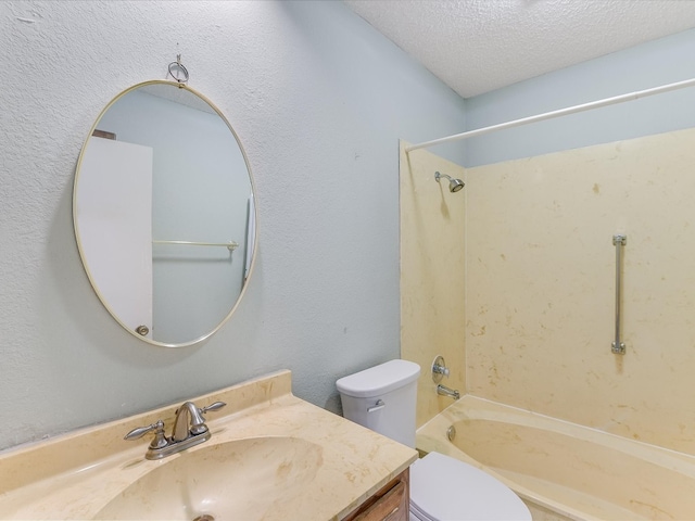 full bathroom featuring vanity, a textured ceiling, shower / bath combination, and toilet