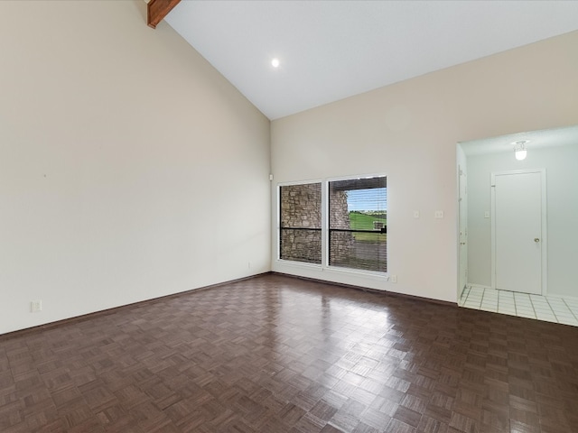 unfurnished room with high vaulted ceiling, beam ceiling, and dark parquet flooring