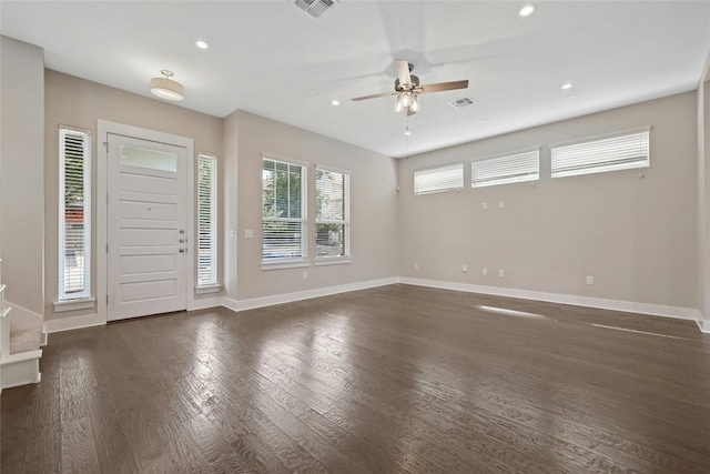 foyer entrance with ceiling fan and dark hardwood / wood-style flooring