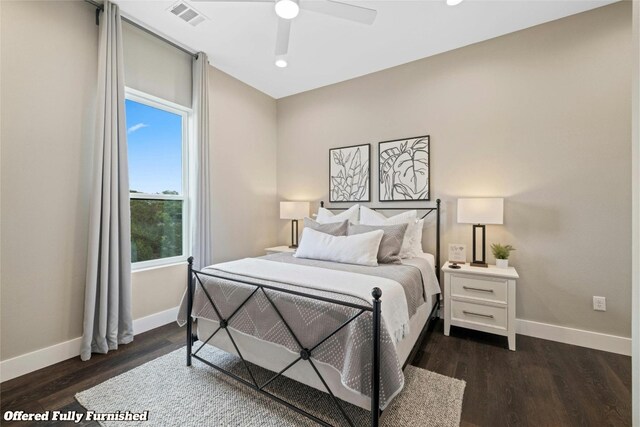 bedroom with ceiling fan and dark wood-type flooring