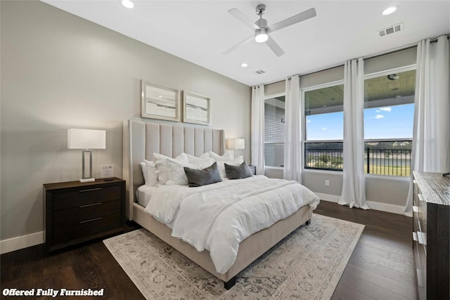 bedroom with recessed lighting, visible vents, dark wood finished floors, and baseboards