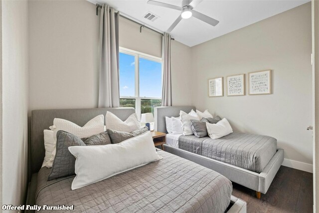 bedroom with ceiling fan and wood-type flooring