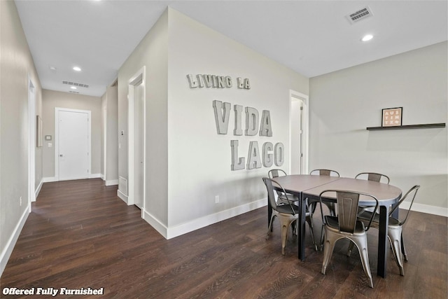 dining area with dark wood-type flooring