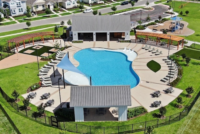 pool with a pergola, a patio, fence, a residential view, and an outdoor structure