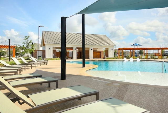 pool with a pergola and a patio area