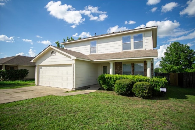 front of property featuring a garage and a front lawn