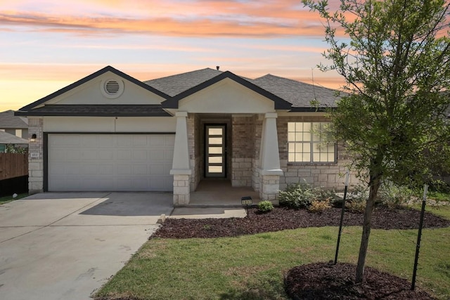 1837 Flying Horseshoe Bnd, Georgetown, TX 78628 - view of front of property with a garage, concrete driveway, a shingled roof, and a lawn