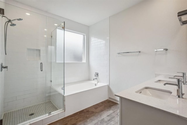 1837 Flying Horseshoe Bnd, Georgetown, TX 78628 - full bathroom featuring a stall shower, a bath, wood finished floors, double vanity, and an AC wall unit