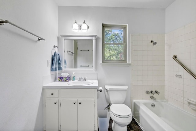 bathroom featuring toilet, bathtub / shower combination, and vanity