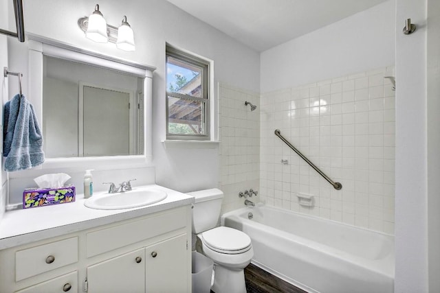 1504 Colony Creek Dr, Austin, TX 78758 - full bath featuring toilet, shower / bathtub combination, wood finished floors, and vanity