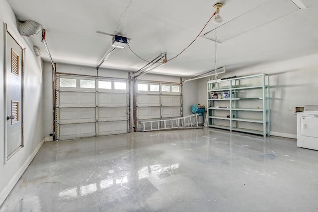 1504 Colony Creek Dr, Austin, TX 78758 - garage featuring baseboards, a garage door opener, and washer / clothes dryer