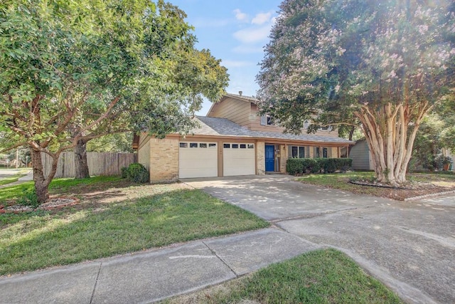 view of front of home featuring brick siding, concrete driveway, fence, a garage, and a front lawn