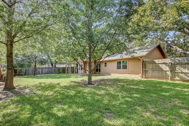 view of yard with a fenced backyard