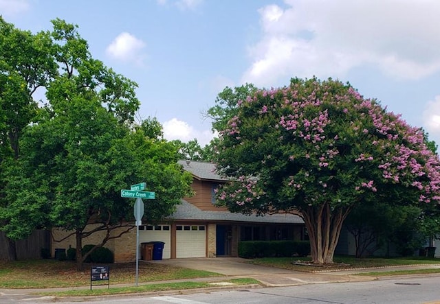 1504 Colony Creek Dr, Austin, TX 78758 - view of front of property with brick siding and driveway