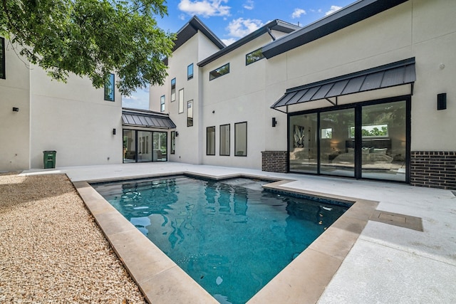 view of swimming pool with a patio area