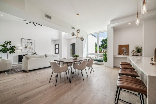 dining space with light wood-type flooring