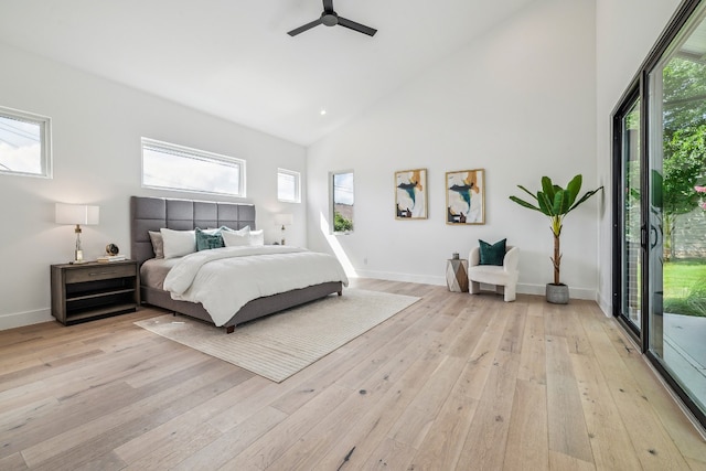 bedroom featuring access to exterior, ceiling fan, high vaulted ceiling, and light hardwood / wood-style floors