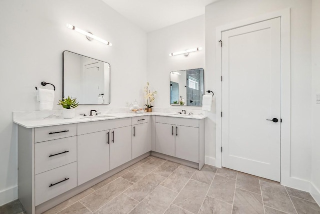 bathroom with a sink and double vanity