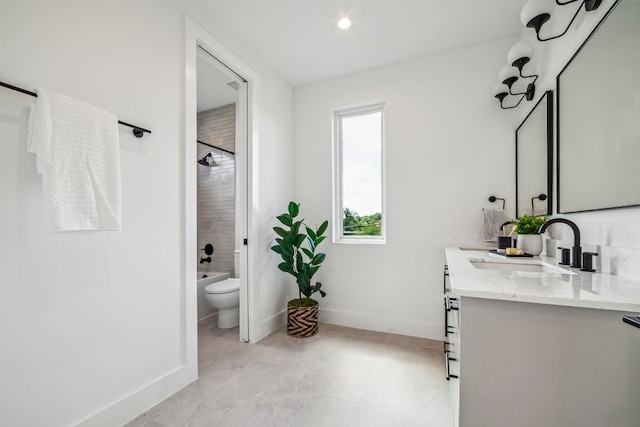 full bathroom with vanity, toilet, and tiled shower / bath