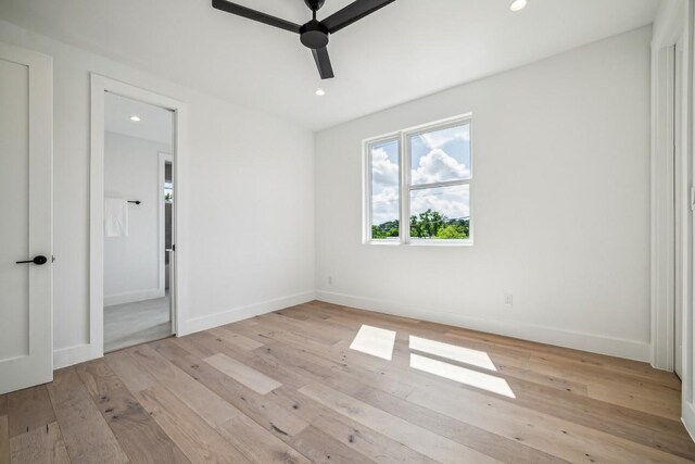 unfurnished bedroom featuring ceiling fan and light wood-type flooring