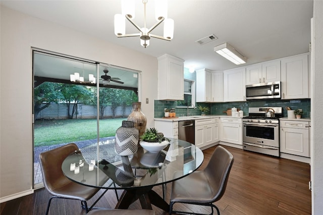 kitchen with visible vents, appliances with stainless steel finishes, white cabinets, and light countertops