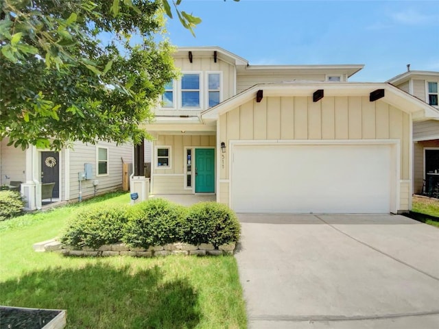 view of front of property featuring a garage and a front yard