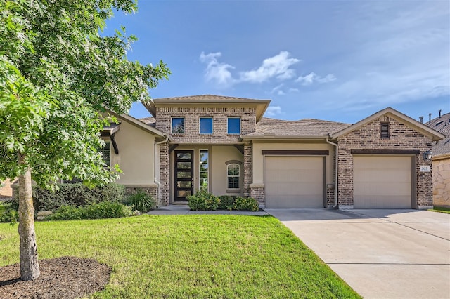 view of front of house with a front lawn and a garage