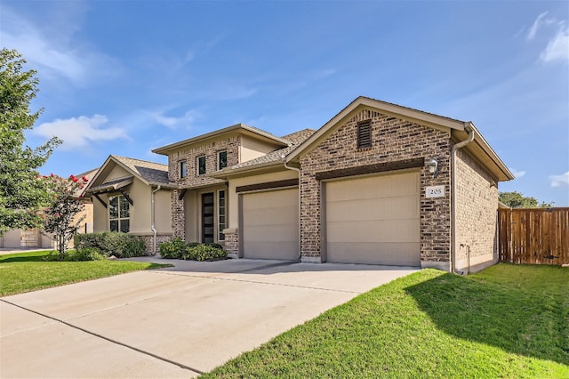 view of front of house featuring a garage and a front yard