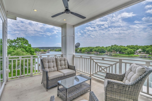 view of patio / terrace with an outdoor hangout area, a balcony, ceiling fan, and a water view