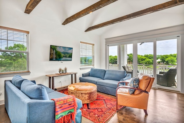 living room featuring hardwood / wood-style flooring and vaulted ceiling with beams