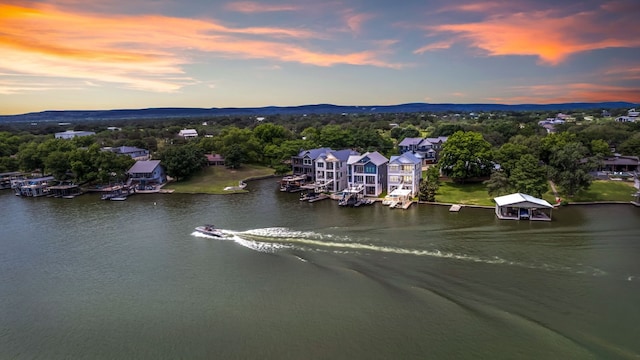 aerial view at dusk with a water view