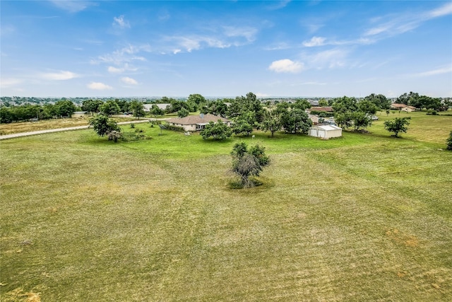 view of yard with a rural view