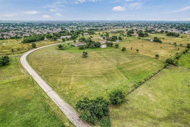 birds eye view of property with a rural view