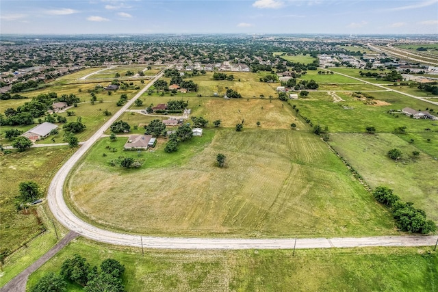 birds eye view of property featuring a rural view