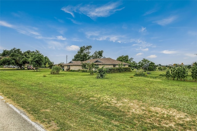 view of yard with a rural view