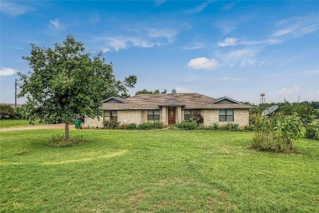 ranch-style home featuring a front yard