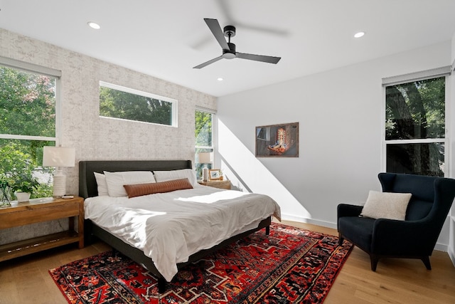 bedroom with wood-type flooring and ceiling fan