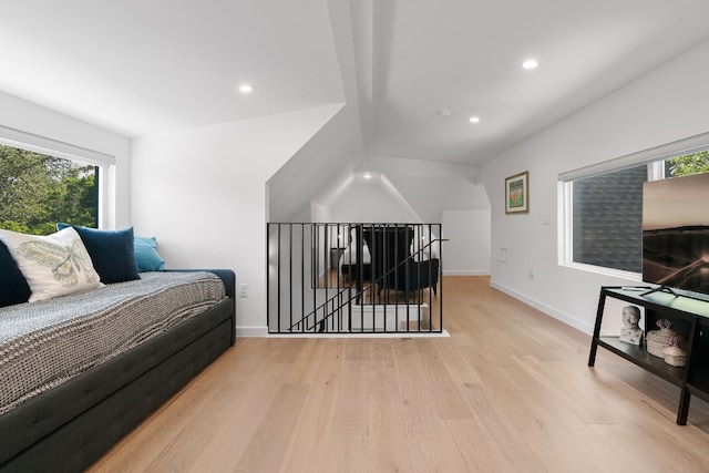 bedroom featuring light wood-type flooring and multiple windows