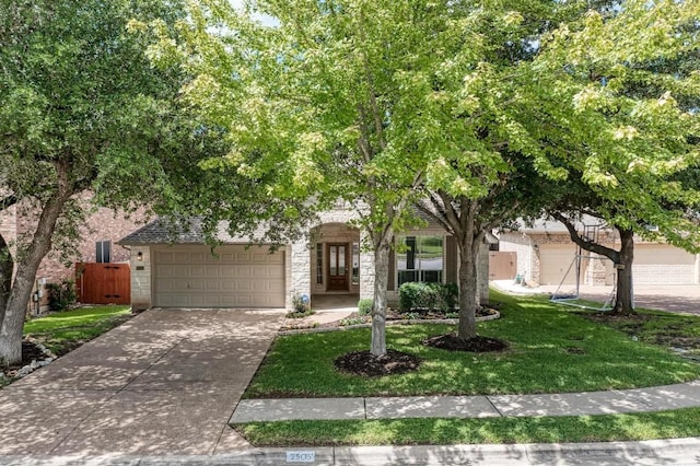 obstructed view of property with a front lawn