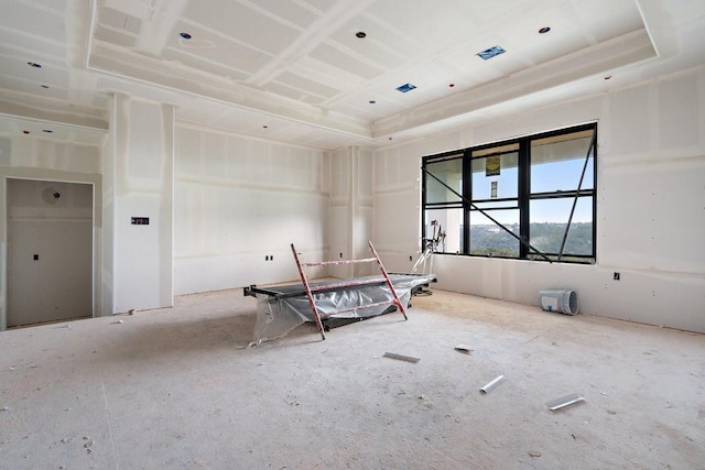 unfurnished room featuring a tray ceiling