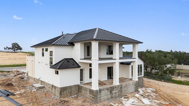 rear view of house with a balcony