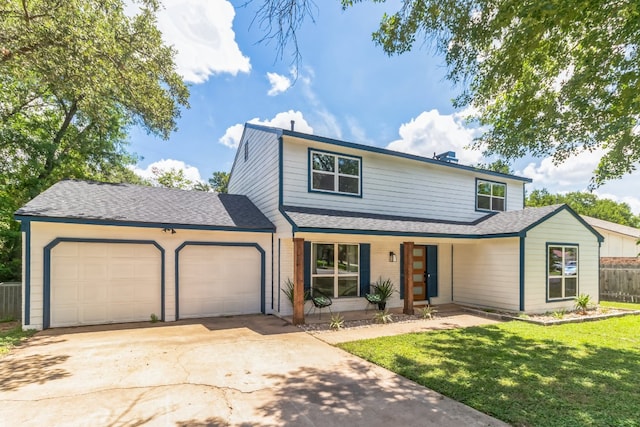 front of property featuring a garage and a front yard