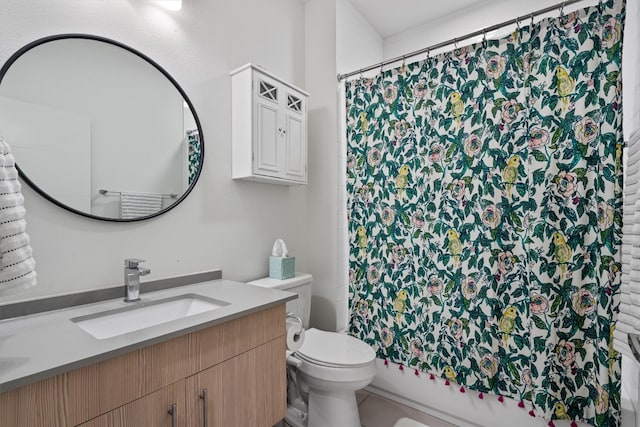 full bathroom with shower / tub combo with curtain, vanity, and toilet