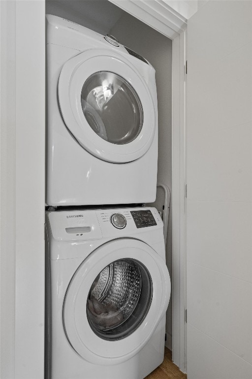 laundry area with stacked washer / drying machine